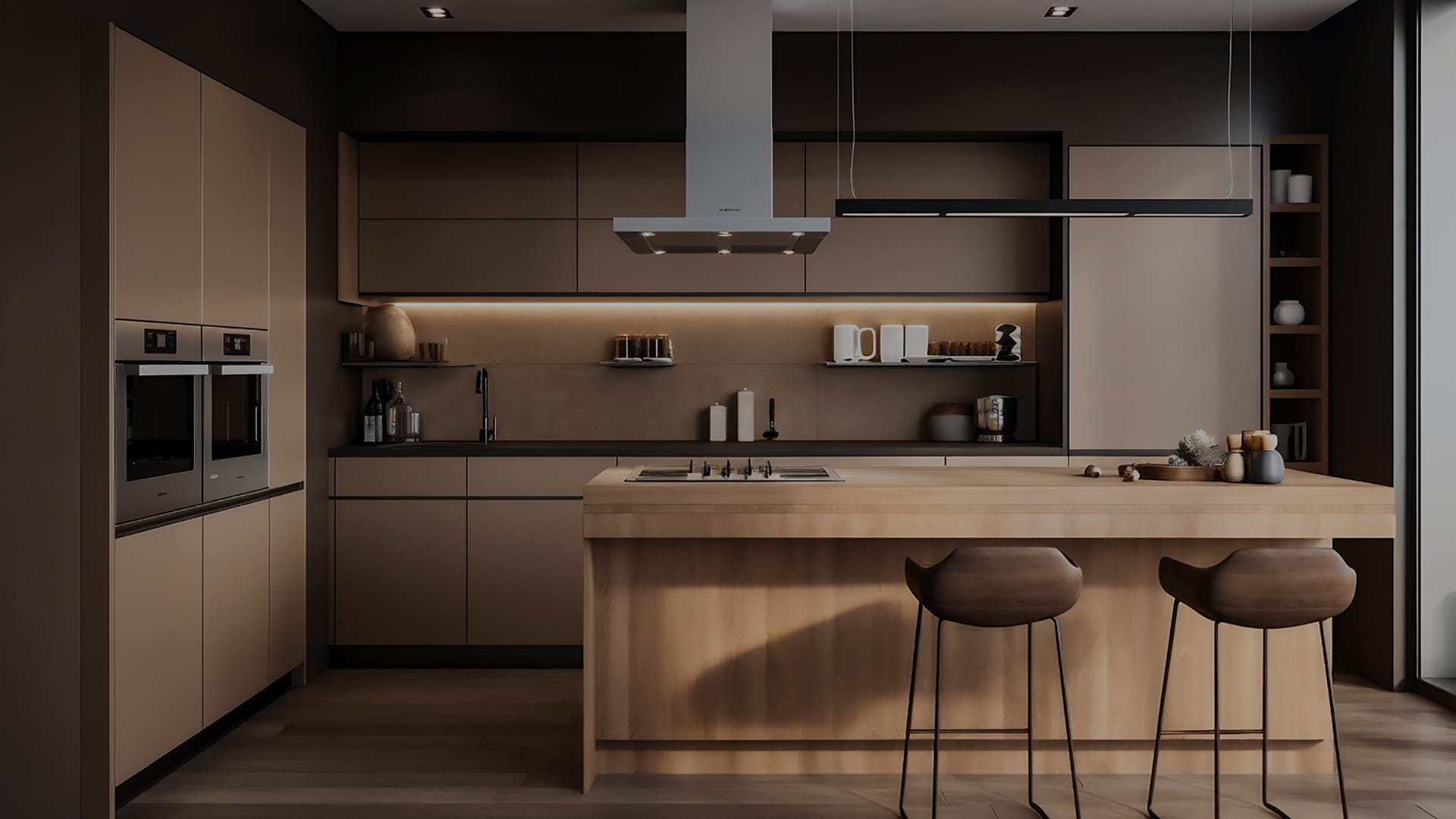 Dark modern kitchen with a wood island, bar stools and tall cabinets