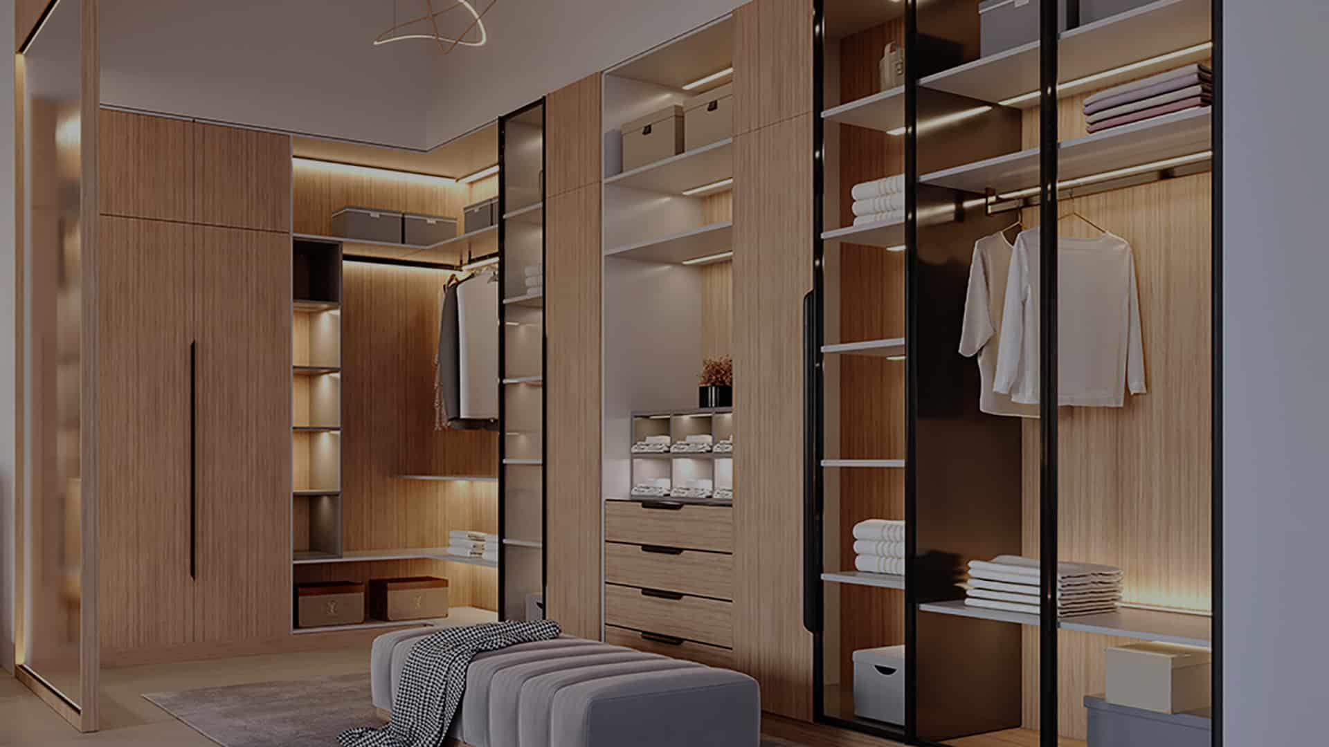 Walk-in closet with lit wood shelving and hanging space