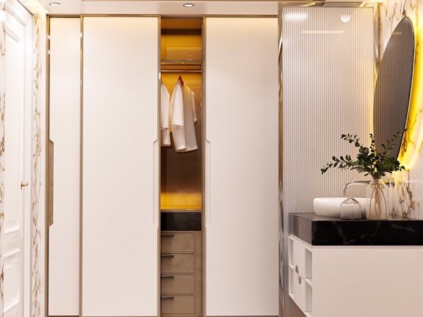 White wardrobe with sliding doors and a lit interior