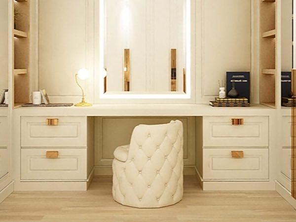 Cream dressing desk with drawers, gold handles and a lit mirror